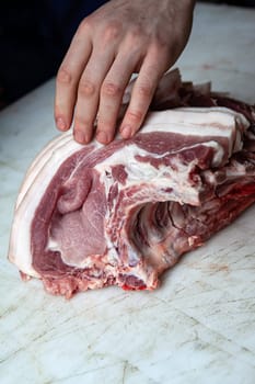 Piece of pork on a butcher block