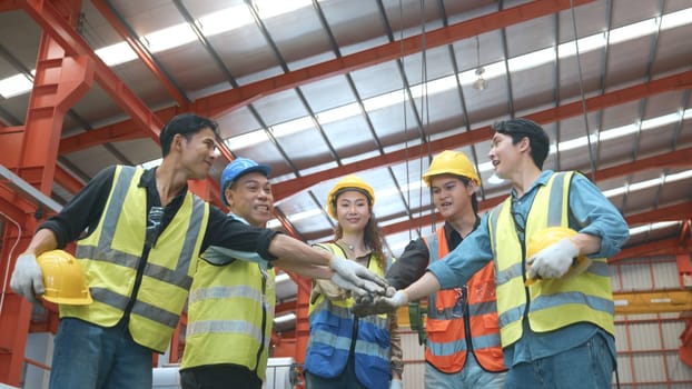 Factory Workers join stacking hand together for collaboration in Metal Sheet factory, Workers hands touching and Join hand for collaboration for successfully, Industrial people and manufacturing labor