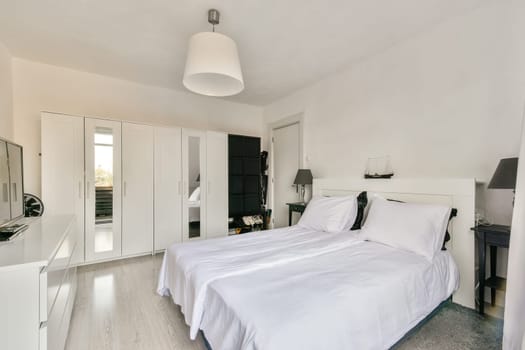 A sleek, modern bedroom design featuring a comfortable bed, minimalist furniture, and a well-organized wardrobe, perfect for contemporary living.