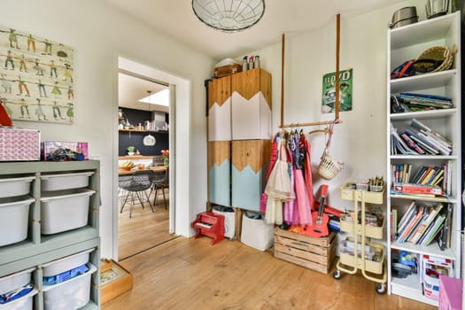 A beautifully designed room interior featuring organized storage solutions, colorful decor, and natural lighting that enhances the space's charm.
