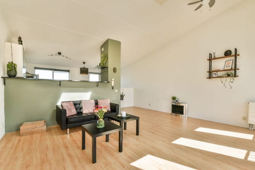 A sleek and spacious interior featuring a minimalist design with natural light, contemporary furniture, and a calming color palette that enhances the open space.