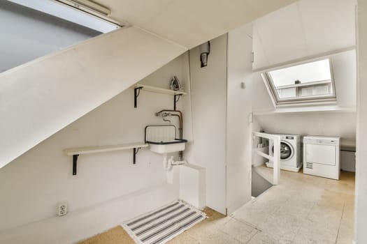 A clean and functional laundry room featuring a skylight, white appliances, and minimalist design, providing an efficient space for washing clothes.