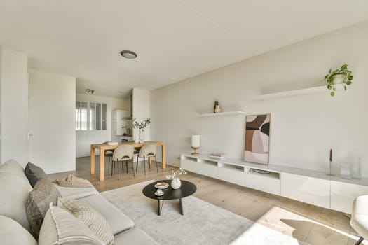 Minimalist modern living room featuring neutral tones, stylish furniture, and a cozy atmosphere that encourages relaxation and comfort in a contemporary setting.