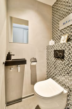 Elegant and contemporary bathroom featuring sleek fixtures, a stylish mirror, and chic wall tiles. A perfect blend of functionality and aesthetics for modern living.