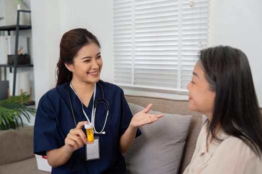 A nurse explains medication to an elderly woman, fostering understanding and connection during their health check-in at home.