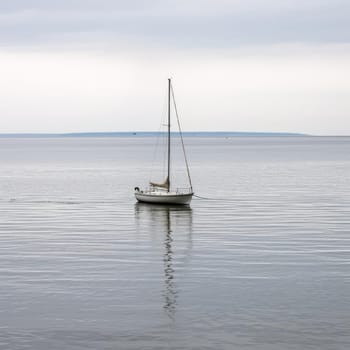 Sailboat in the sea on a cloudy day