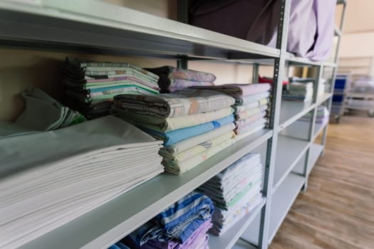 Sanitary prevention antivirus concept. Fresh White Hotel Towels Folded and Stacked on Shelf