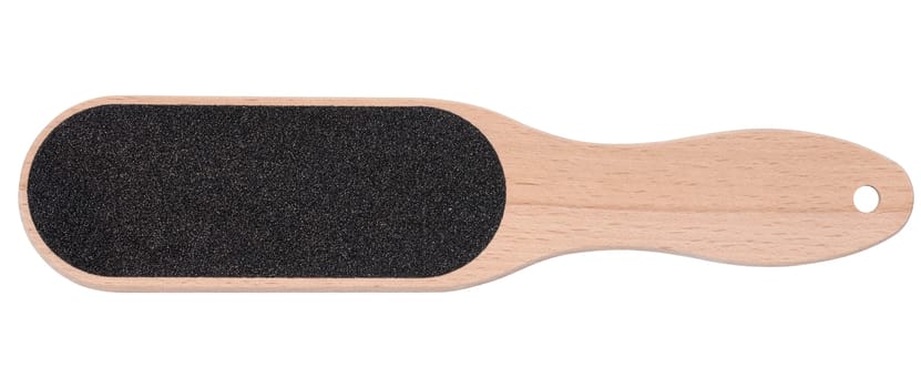 Wooden spatula with an emery surface for pedicure on a white isolated background, top view