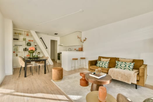 A stylish, modern living space featuring a cozy seating area, dining table, and warm decor elements. Perfectly balancing comfort and aesthetics for contemporary living.