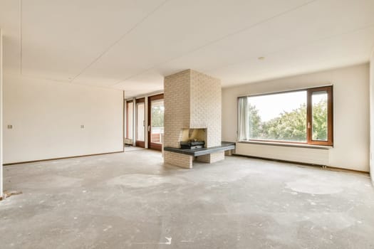 A spacious, minimalist interior showcasing clean lines, large windows, and a light color palette. Ideal for modern living or aesthetic design inspiration.
