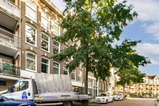 A vibrant urban street scene featuring a stately building, lush trees, and parked vehicles, depicting the harmony of nature and city life.