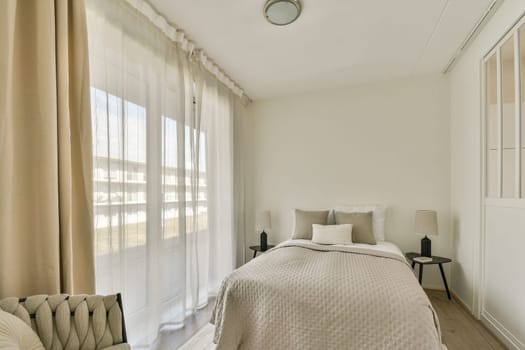 A serene and minimalist bedroom featuring soft linens, natural light filtering through sheer curtains, and a simple color palette for a relaxing atmosphere.