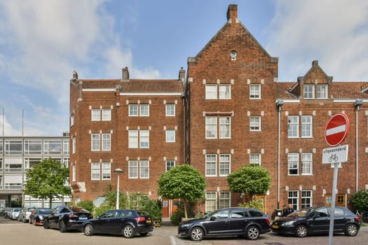 A striking blend of historic brick architecture set against modern developments, showcasing urban evolution and design contrast.