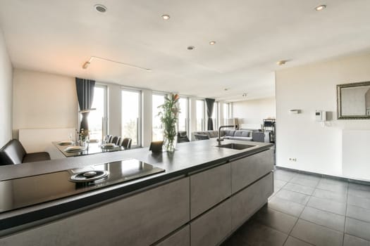 Contemporary kitchen showcasing sleek cabinetry, elegant finishes, and ample natural light, perfect for culinary creativity and social gatherings.