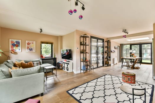 A beautifully designed living room featuring modern furniture, warm lighting, and unique decor elements that create an inviting atmosphere.