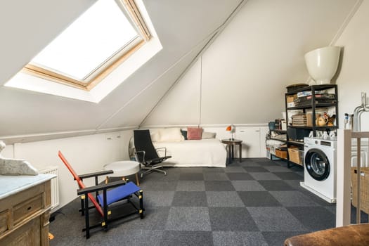 A serene attic bedroom featuring modern furnishings, a skylight for natural light, and a warm color palette that enhances the cozy atmosphere.