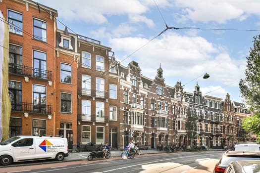 A picturesque urban scene featuring classic architecture, trees lining the street, and bicycles parked along the road, capturing the essence of city life.