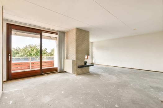 A bright and airy modern apartment interior featuring large windows, neutral walls, and an open layout prepared for furnishings, creating a serene living environment.