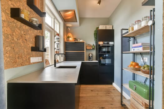 This image showcases a modern kitchen featuring contemporary appliances and stylish decor. The minimalist design emphasizes clean lines and functionality.