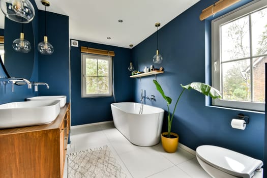 A contemporary bathroom featuring a sleek wooden vanity, stylish sinks, and accent lighting, complemented by a soothing color scheme.