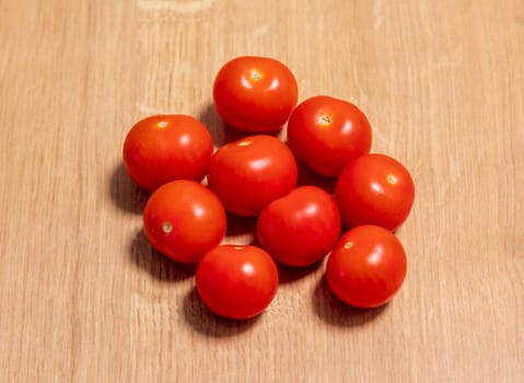 Cherry tomatoes on the wooden surface