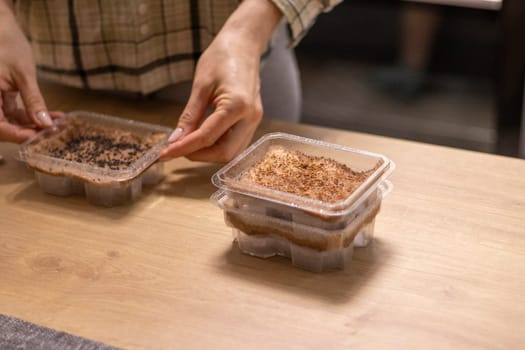 Person plants seeds of micro greens to the jute mat.