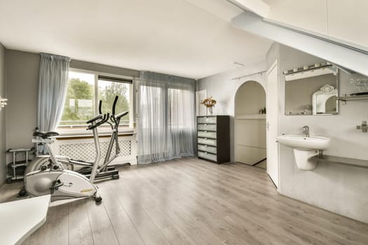 A contemporary home gym space featuring exercise equipment, natural light, and sleek design elements, creating an inviting atmosphere for fitness activities.