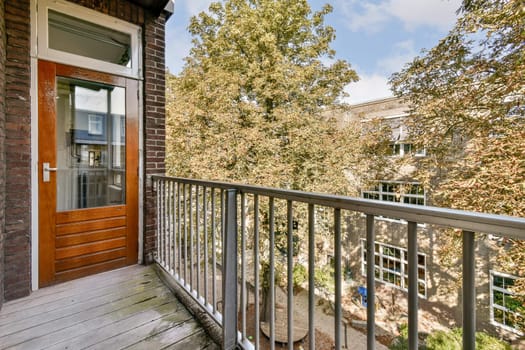 A stylish modern balcony view showcasing lush greenery and well-maintained foliage, blending urban architecture with nature's beauty.
