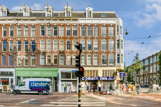 A lively street view featuring classic Dutch architecture, bustling traffic, and the Corner Inn sign, showcasing the charm of urban life.