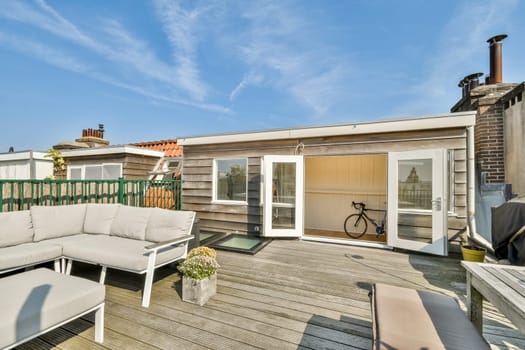 A contemporary outdoor area featuring a comfortable seating arrangement, blending modern design with natural surroundings for relaxation and social gatherings.