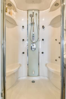 Sleek and contemporary shower design showcasing multiple showerheads and a clean, minimalistic aesthetic. Ideal for modern bathrooms.