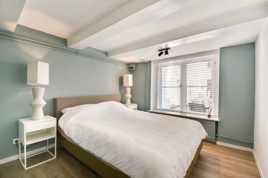 A beautifully designed modern bedroom featuring soft colors and minimalistic decor, creating a serene and inviting atmosphere perfect for relaxation.
