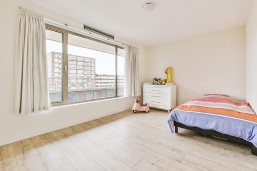 Home interior design of bedroom with bed and wooden wardrobe placed in corner near window in modern apartment