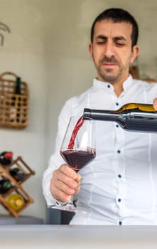 Glass of red wine in hands. Selective focus. drink.