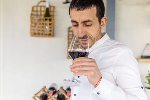 Glass of red wine in hands. Selective focus. drink.