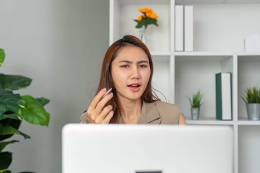 In an online meeting, a woman addresses concerns, ensuring effective communication and collaboration, while looking to gain understanding from the team.