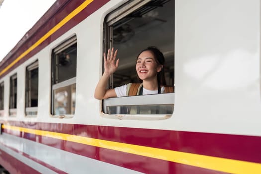 As her train departs, she waves goodbye, filled with happiness and a sense of adventure for the journey ahead.