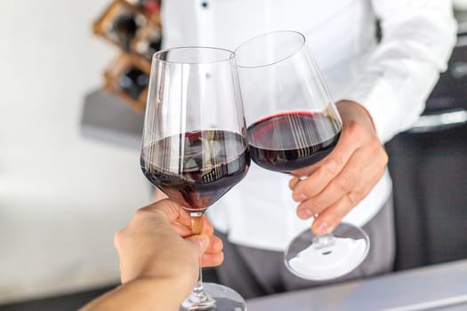 Glass of red wine in hands. Selective focus. drink.
