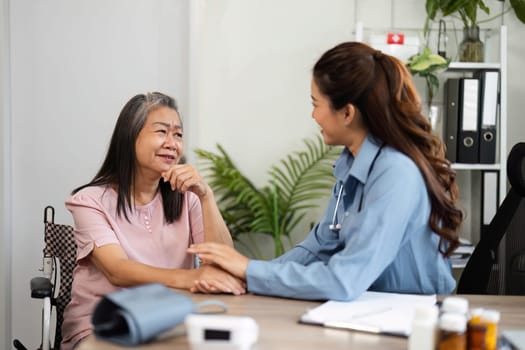 The nurse and elderly patient share a moment of connection as they discuss health topics, showcasing trust and emotional support in healthcare.
