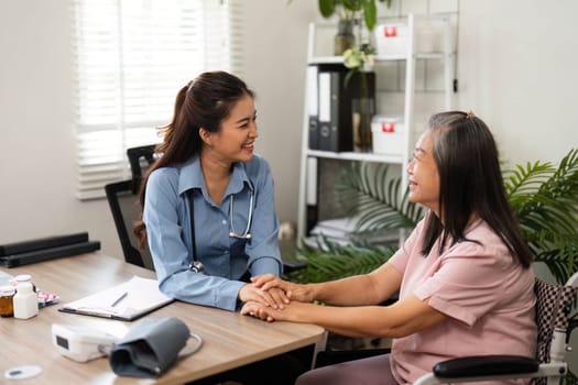 The friendly atmosphere allows for a positive exchange, with the nurse reassuring the elderly patient during their health discussion.