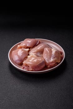 Chicken thigh fillet raw, skinless, boneless, poultry legs with salt and spices