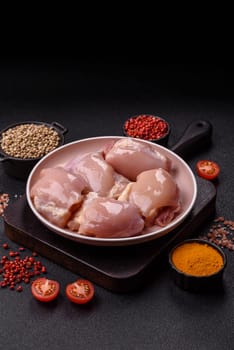 Chicken thigh fillet raw, skinless, boneless, poultry legs with salt and spices