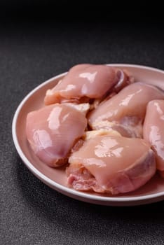 Chicken thigh fillet raw, skinless, boneless, poultry legs with salt and spices