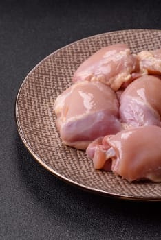 Chicken thigh fillet raw, skinless, boneless, poultry legs with salt and spices