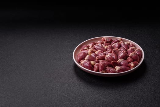 Chicken raw heart, red duck or turkey internal organs as an ingredient for dinner preparation