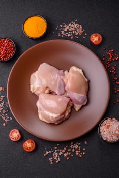 Chicken thigh fillet raw, skinless, boneless, poultry legs with salt and spices
