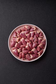 Chicken raw heart, red duck or turkey internal organs as an ingredient for dinner preparation
