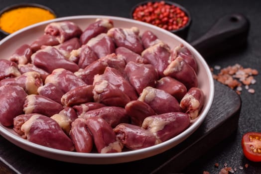Chicken raw heart, red duck or turkey internal organs as an ingredient for dinner preparation