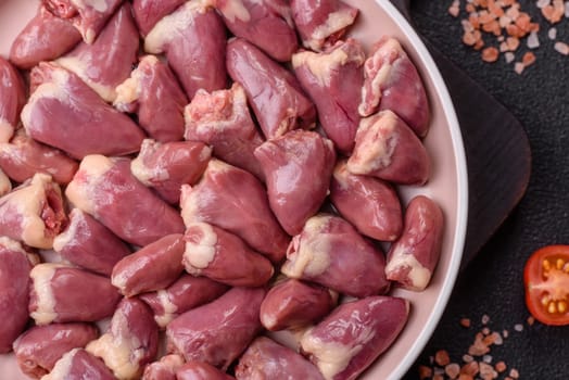 Chicken raw heart, red duck or turkey internal organs as an ingredient for dinner preparation