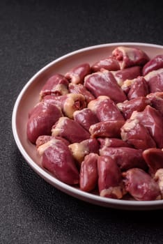 Chicken raw heart, red duck or turkey internal organs as an ingredient for dinner preparation